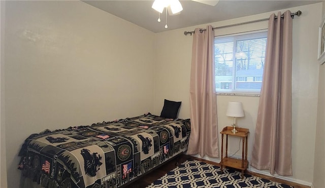 bedroom with ceiling fan and wood finished floors