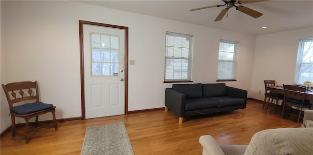 interior space featuring baseboards, recessed lighting, a ceiling fan, and light wood-style floors