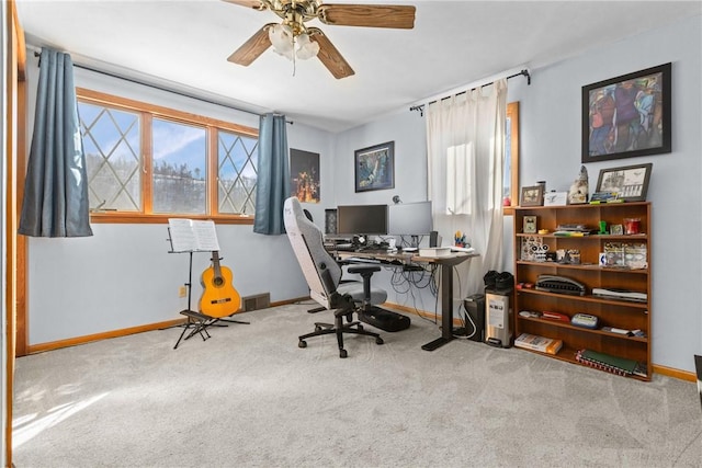 home office featuring ceiling fan, carpet flooring, visible vents, and baseboards