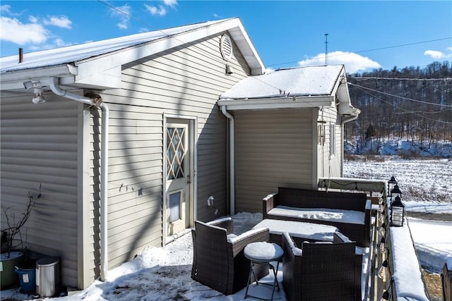 view of snow covered house