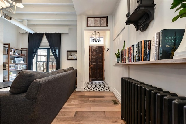 entrance to property featuring visible vents and radiator heating unit