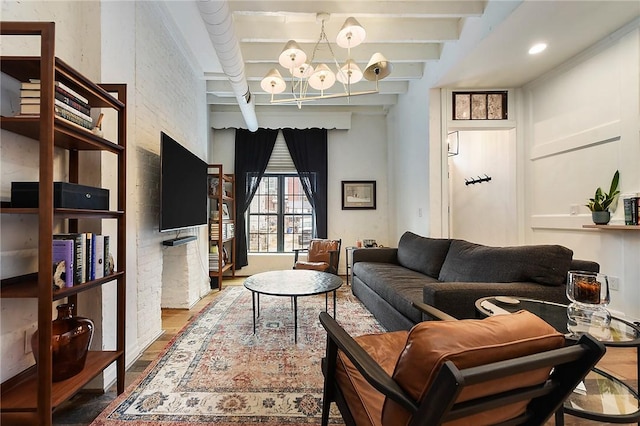 living room featuring a chandelier, wood finished floors, and beam ceiling