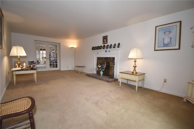 living room featuring carpet, a fireplace, and french doors