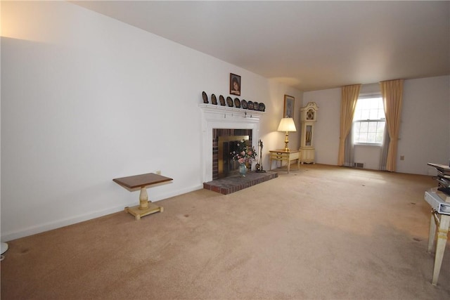 unfurnished living room with carpet floors, a fireplace, and baseboards