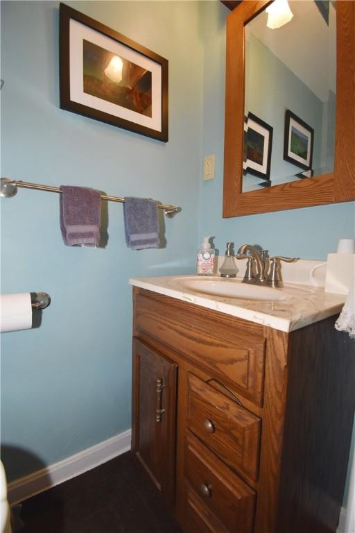 bathroom with vanity and baseboards