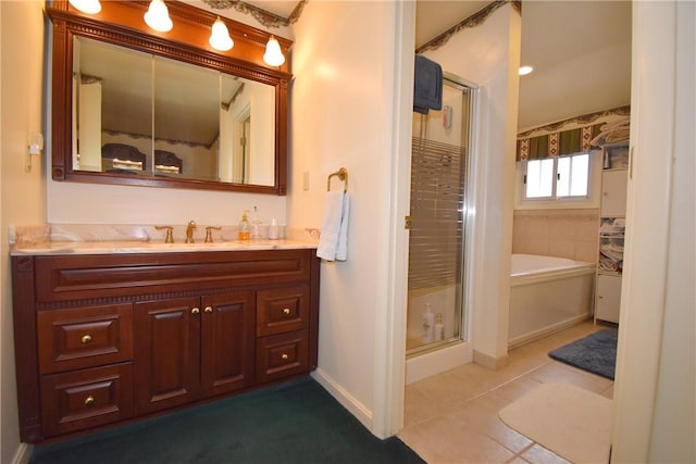 full bathroom featuring tile patterned floors, a shower stall, vanity, baseboards, and a bath