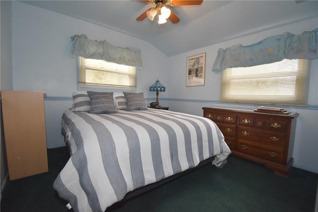 carpeted bedroom featuring lofted ceiling and ceiling fan