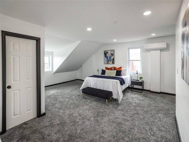 bedroom featuring lofted ceiling, an AC wall unit, multiple windows, and carpet