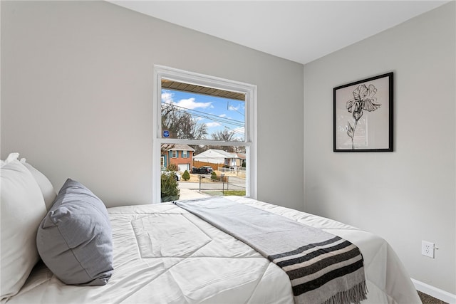 bedroom featuring baseboards