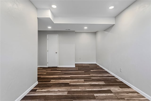 below grade area with recessed lighting, baseboards, and wood finished floors