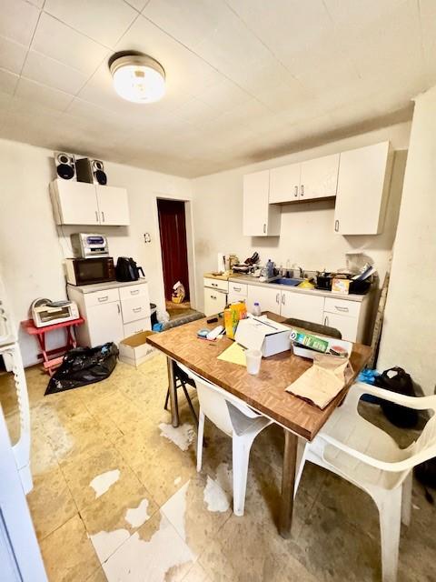 kitchen featuring white cabinetry