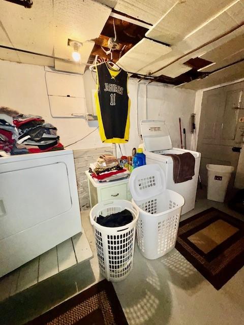 laundry area with laundry area and separate washer and dryer