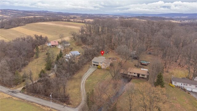 bird's eye view featuring a rural view and a forest view