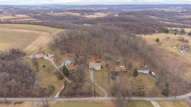 birds eye view of property featuring a rural view