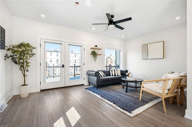 living room featuring french doors, wood finished floors, and recessed lighting