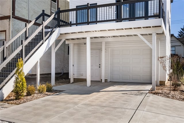 view of home's exterior with stairs and driveway