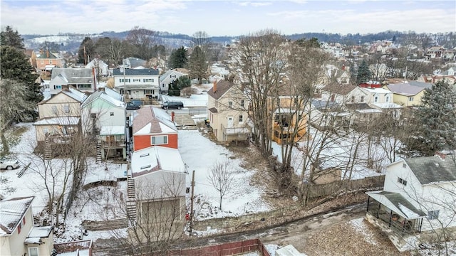 snowy aerial view featuring a residential view