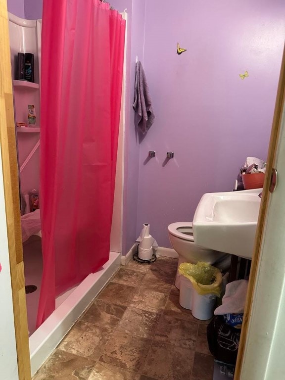 202 Central Ave, Chicora Boro, PA 16025 - full bathroom with a shower stall, toilet, stone finish flooring, and a sink