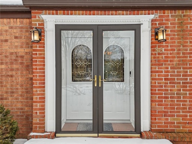 entrance to property with french doors and brick siding