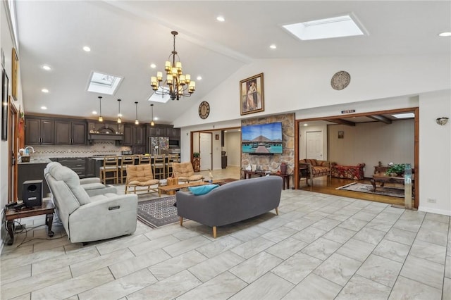 living room featuring a skylight, a chandelier, marble finish floor, high vaulted ceiling, and recessed lighting