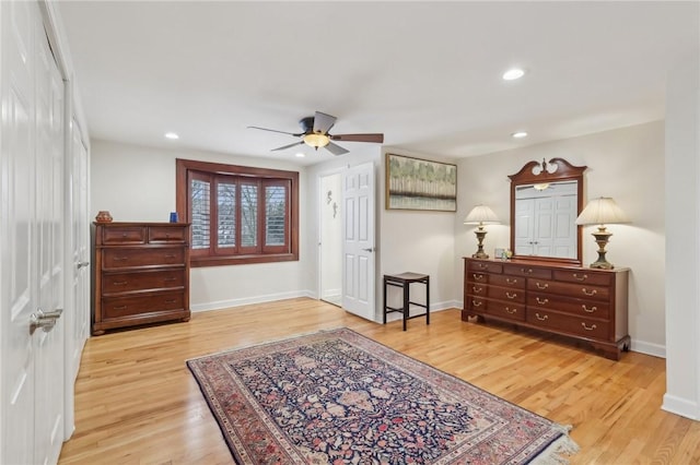 sitting room with a ceiling fan, baseboards, wood finished floors, and recessed lighting