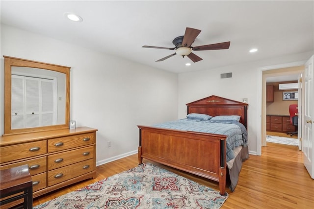 bedroom featuring light wood finished floors, baseboards, visible vents, and recessed lighting