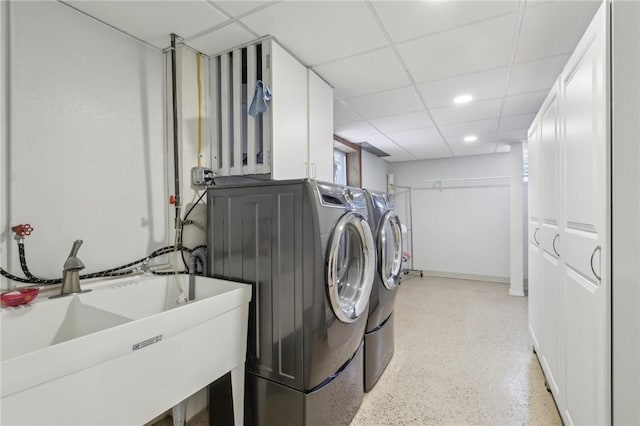 laundry room featuring laundry area, washer and clothes dryer, a sink, and recessed lighting