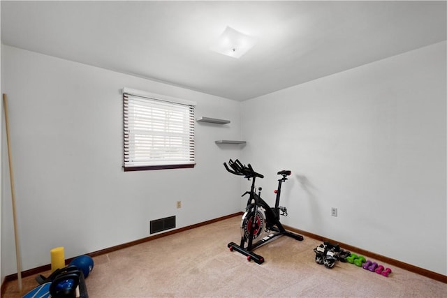 exercise area with carpet, visible vents, and baseboards