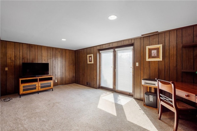 office area featuring light carpet, wooden walls, and recessed lighting