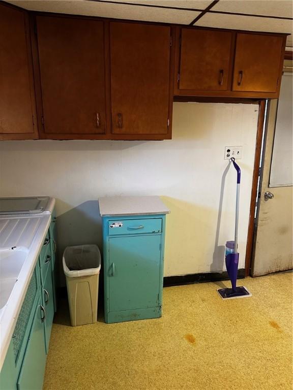 kitchen with light countertops and a sink