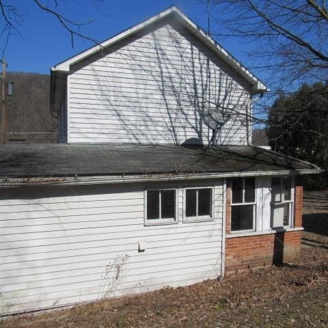 view of home's exterior with brick siding