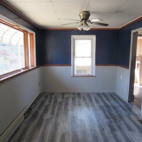 unfurnished room featuring a ceiling fan and wood finished floors