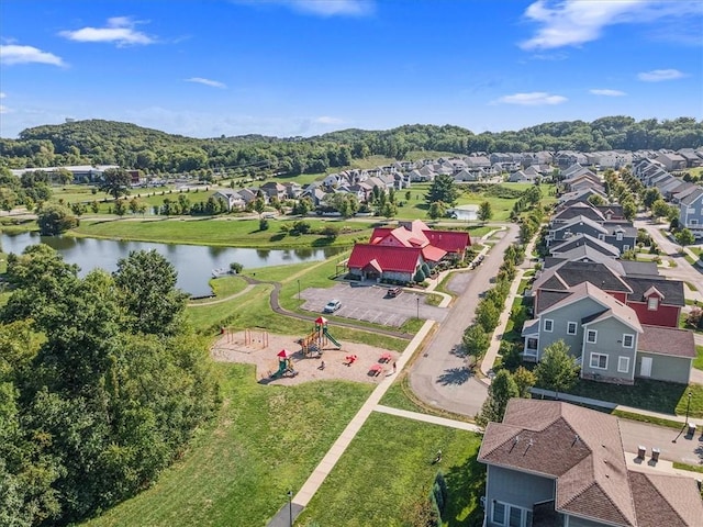 drone / aerial view featuring a water view and a residential view