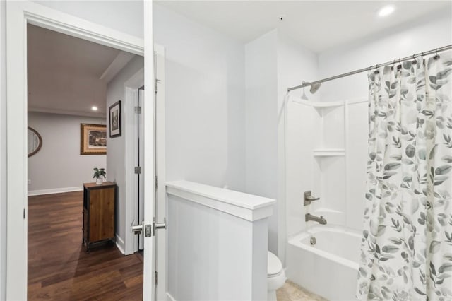 bathroom featuring toilet, recessed lighting, wood finished floors, baseboards, and shower / bath combination with curtain