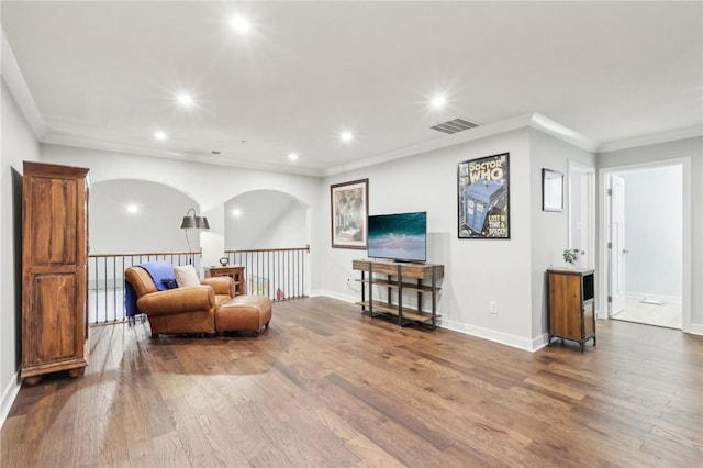 sitting room featuring recessed lighting, visible vents, crown molding, and wood finished floors