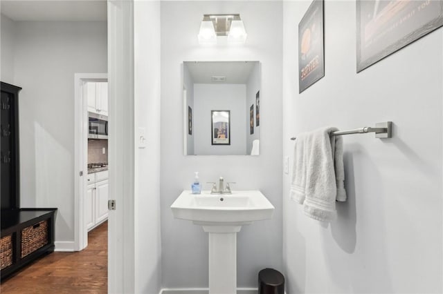 bathroom with wood finished floors