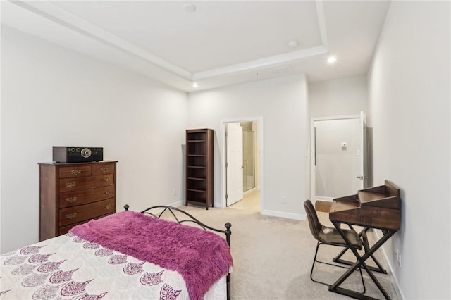 bedroom featuring recessed lighting, a raised ceiling, light carpet, and baseboards