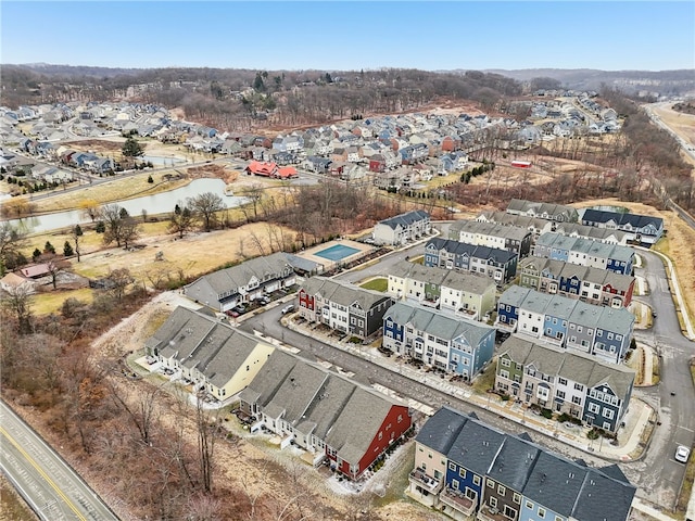 birds eye view of property with a water view and a residential view