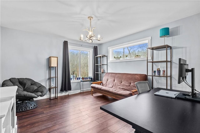 office area with a wealth of natural light, baseboards, a chandelier, and wood finished floors