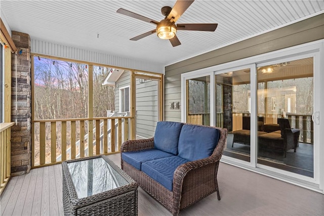 sunroom / solarium with ceiling fan