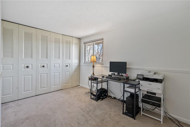 office space with carpet flooring and baseboards