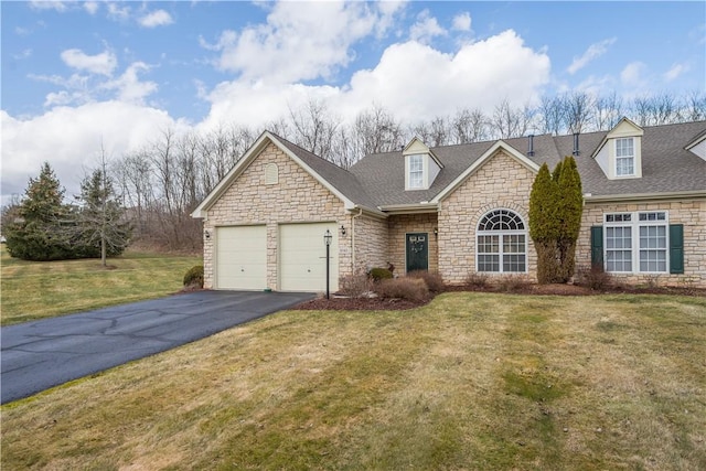 view of front facade featuring aphalt driveway, a front lawn, an attached garage, and roof with shingles