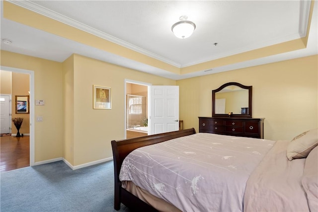 bedroom with a tray ceiling, carpet flooring, baseboards, and ornamental molding