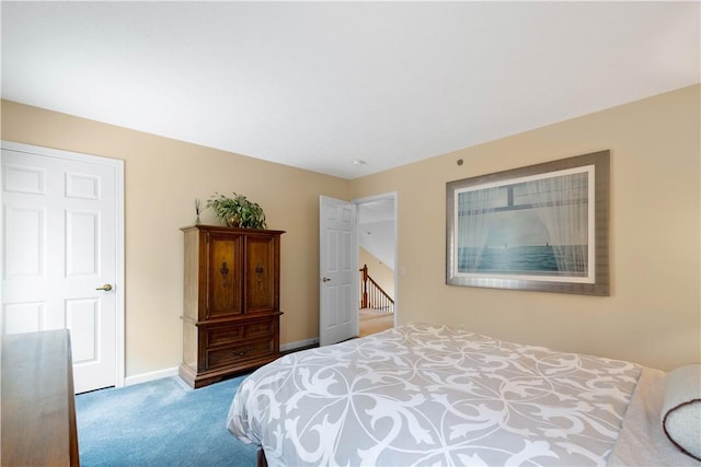 bedroom with baseboards and carpet flooring