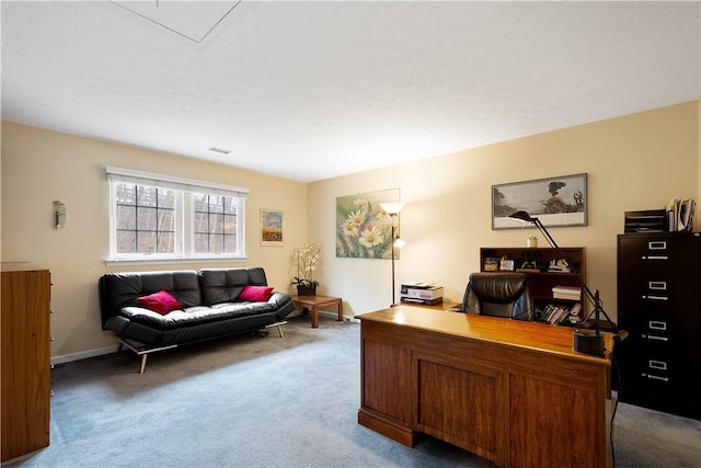 carpeted home office featuring visible vents and baseboards