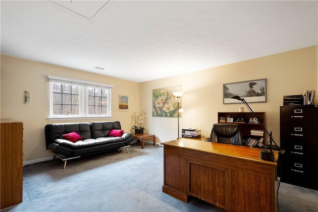 carpeted office space featuring baseboards and visible vents