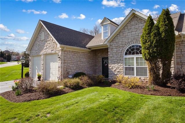 view of front of home with roof with shingles, stone siding, concrete driveway, a garage, and a front yard