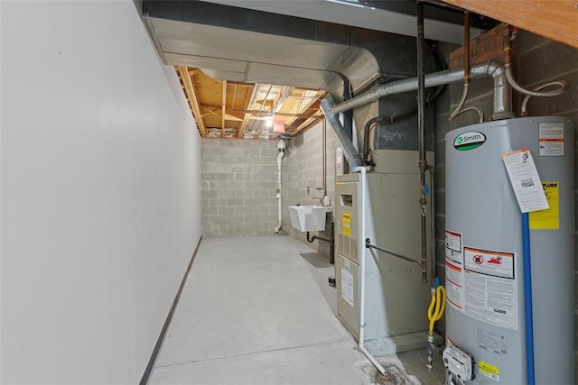 unfinished below grade area featuring concrete block wall, water heater, and a sink