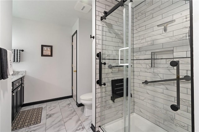 bathroom featuring a stall shower, baseboards, toilet, marble finish floor, and vanity