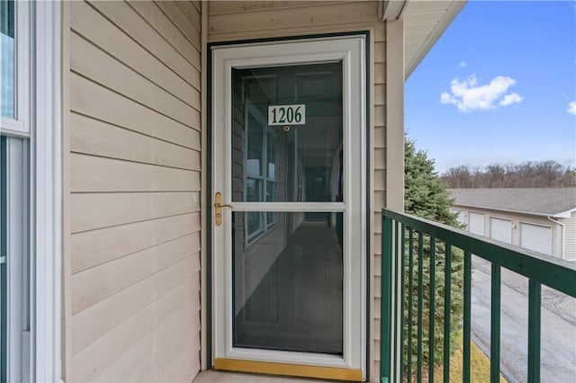 doorway to property featuring a balcony